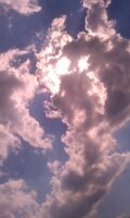 Clouds in front of the sun